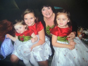 kathy and granddaughters in holly berry dresses